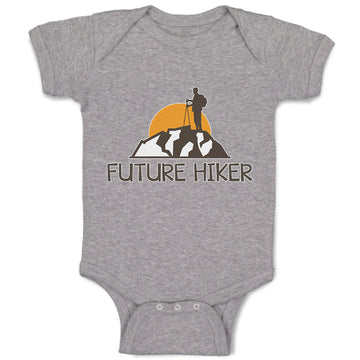 Baby Clothes Future Hiker Tourist Hiking. Man Standing on A Ledge of A Mountain