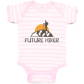 Baby Clothes Future Hiker Tourist Hiking. Man Standing on A Ledge of A Mountain