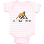 Baby Clothes Future Hiker Tourist Hiking. Man Standing on A Ledge of A Mountain