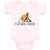 Baby Clothes Future Hiker Tourist Hiking. Man Standing on A Ledge of A Mountain