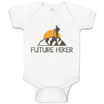 Baby Clothes Future Hiker Tourist Hiking. Man Standing on A Ledge of A Mountain